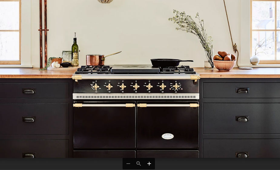 black lacanche range with black cabinets